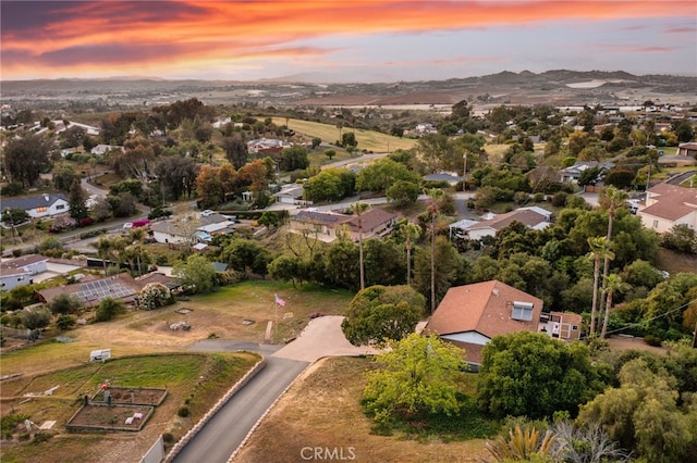 birds eye view of property with a mountain view