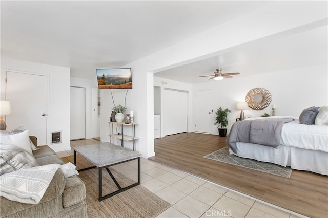 bedroom featuring light tile patterned flooring and a ceiling fan