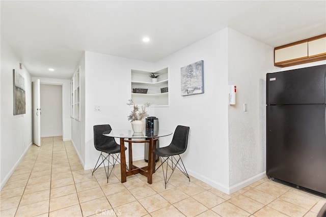 dining space featuring light tile patterned floors, recessed lighting, and baseboards