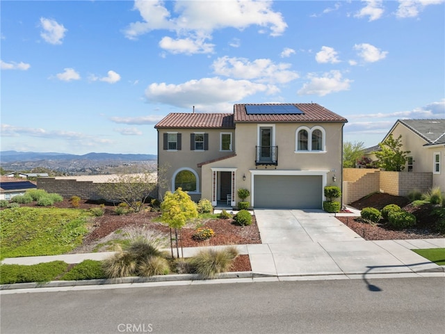 18797 Big Cedar Dr, Canyon Country, CA 91387 - mediterranean / spanish-style home featuring a tiled roof, a garage, roof mounted solar panels, concrete driveway, and stucco siding