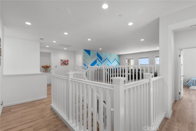 18797 Big Cedar Dr, Canyon Country, CA 91387 - corridor featuring visible vents, wood finished floors, baseboards, recessed lighting, and an upstairs landing
