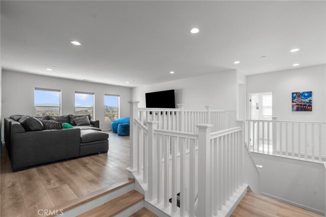 18797 Big Cedar Dr, Canyon Country, CA 91387 - staircase featuring recessed lighting and wood finished floors