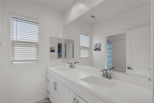 18797 Big Cedar Dr, Canyon Country, CA 91387 - full bathroom with visible vents, a sink, double vanity, and a shower with curtain