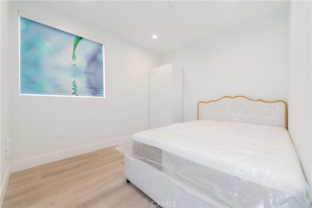 1444 W 37th St, Los Angeles, CA 90018 - bedroom featuring wood finished floors, baseboards, and recessed lighting