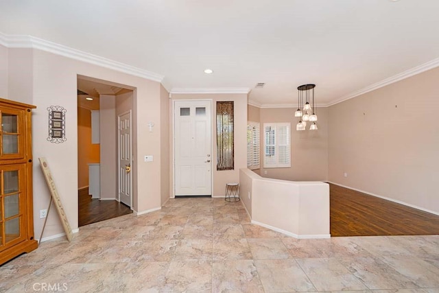 entrance foyer with a chandelier, crown molding, recessed lighting, and baseboards