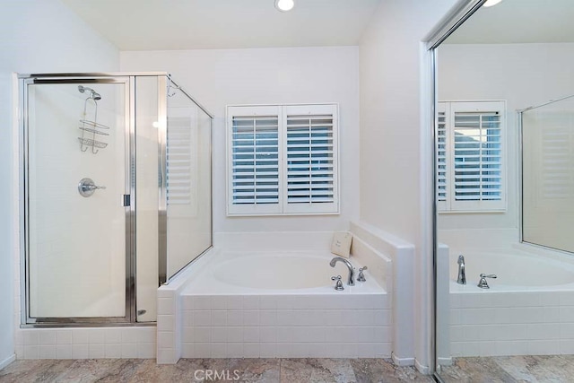 full bath with a shower stall and a bath