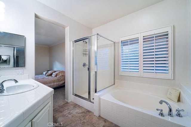 ensuite bathroom with a shower stall, vanity, a bath, crown molding, and ensuite bathroom