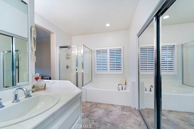 full bathroom featuring vanity, a shower stall, recessed lighting, and a bath