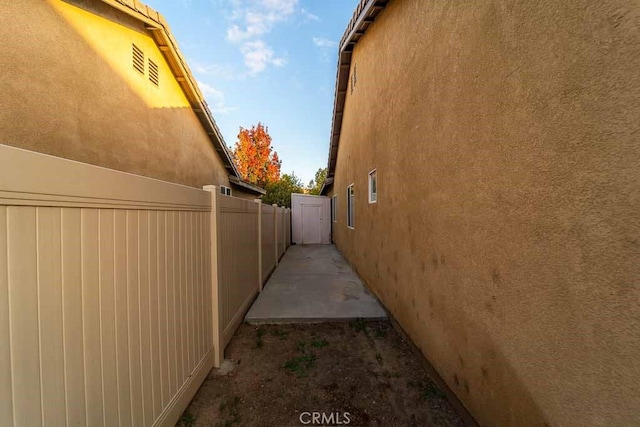view of home's exterior featuring fence and stucco siding