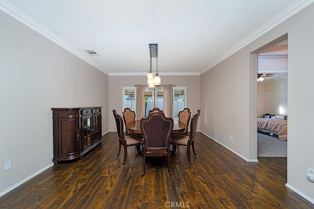 dining room with ornamental molding, dark wood-style floors, visible vents, and baseboards