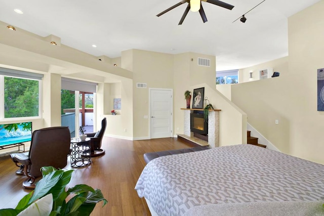 1710 Via Allondra, San Marcos, CA 92078 - bedroom with a glass covered fireplace, baseboards, wood finished floors, and visible vents