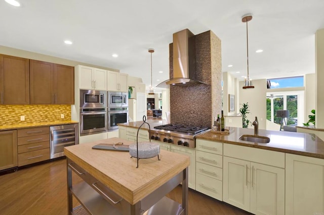 1710 Via Allondra, San Marcos, CA 92078 - kitchen featuring wall chimney range hood, appliances with stainless steel finishes, tasteful backsplash, a sink, and beverage cooler