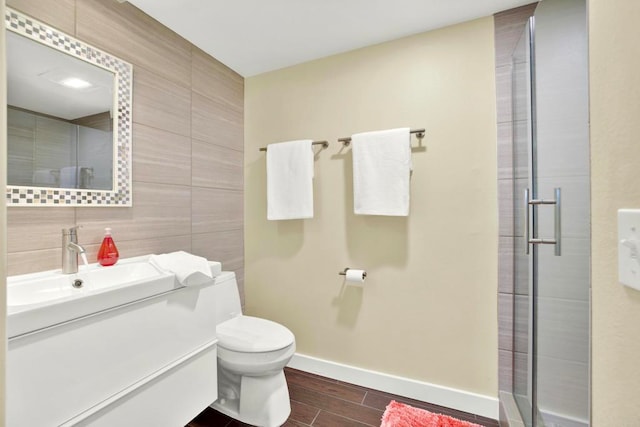 1710 Via Allondra, San Marcos, CA 92078 - bathroom with vanity, wood finished floors, toilet, tile walls, and a stall shower