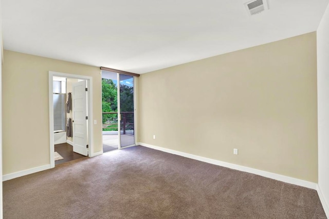 1710 Via Allondra, San Marcos, CA 92078 - empty room with visible vents, baseboards, expansive windows, and dark colored carpet