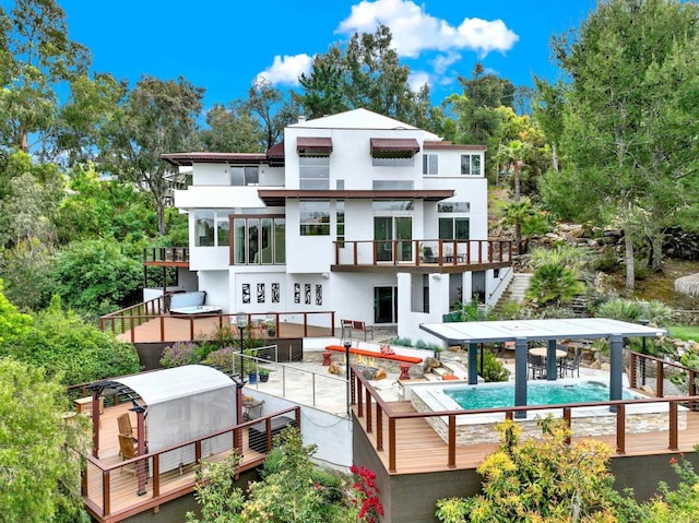 1710 Via Allondra, San Marcos, CA 92078 - rear view of house with stucco siding, stairway, an outdoor pool, a patio area, and a balcony