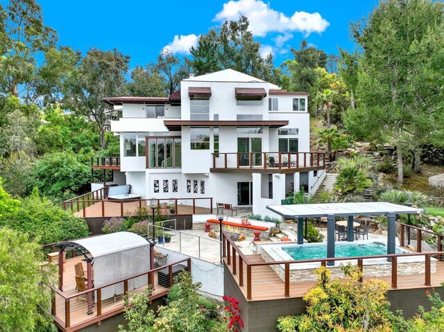 1710 Via Allondra, San Marcos, CA 92078 - rear view of house with stucco siding, stairway, an outdoor pool, a patio area, and a balcony