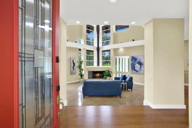 1710 Via Allondra, San Marcos, CA 92078 - living area featuring baseboards, recessed lighting, wood finished floors, and a warm lit fireplace
