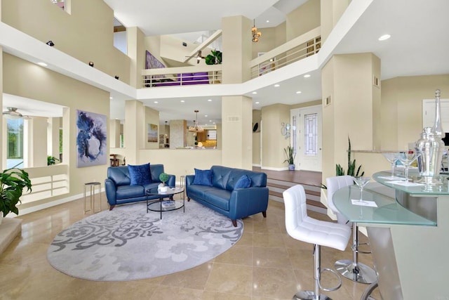 1710 Via Allondra, San Marcos, CA 92078 - tiled living area featuring ceiling fan, visible vents, baseboards, and a towering ceiling