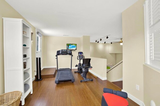 1710 Via Allondra, San Marcos, CA 92078 - exercise area with baseboards, rail lighting, and wood finished floors