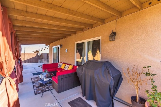 view of patio / terrace featuring outdoor lounge area, a grill, and fence