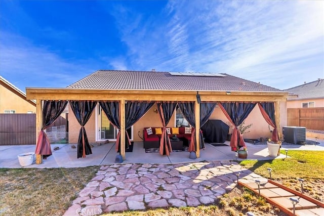 view of patio featuring a grill, a gazebo, central AC, and a fenced backyard