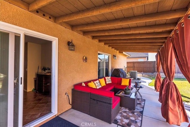view of patio / terrace featuring fence, cooling unit, and an outdoor hangout area