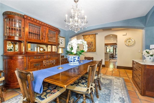 1015 Wild Oats Way, Templeton, CA 93465 - dining room featuring light tile patterned floors, a notable chandelier, visible vents, baseboards, and arched walkways