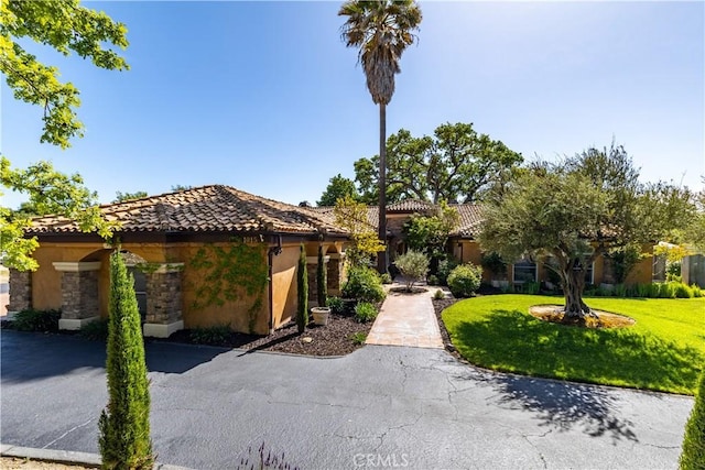 1015 Wild Oats Way, Templeton, CA 93465 - view of front of property with a front yard, stucco siding, and a tiled roof