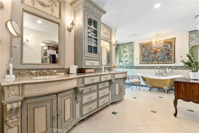 1015 Wild Oats Way, Templeton, CA 93465 - full bath featuring tile patterned floors, tile walls, a sink, a soaking tub, and a notable chandelier
