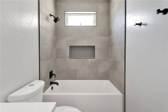 bathroom with shower / bathtub combination, toilet, and vanity