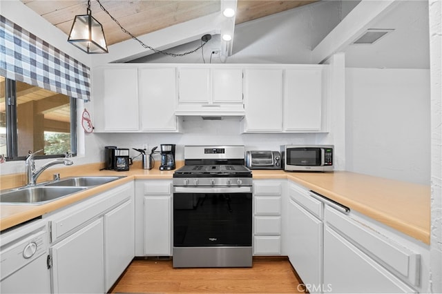 kitchen with white cabinets, a sink, stainless steel appliances, under cabinet range hood, and a toaster