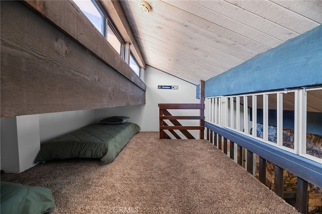 bedroom with vaulted ceiling and carpet floors