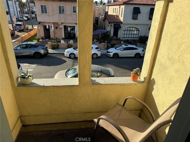 view of car parking featuring a residential view