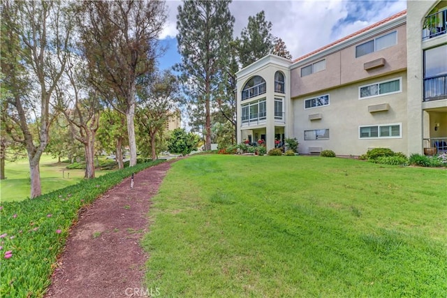 surrounding community with a yard