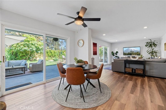 dining space featuring light wood-type flooring, ceiling fan, and recessed lighting