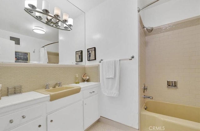 11767 W Sunset Blvd Unit 206, Los Angeles, CA 90049 - bathroom with vanity, backsplash, and shower / bathtub combination with curtain