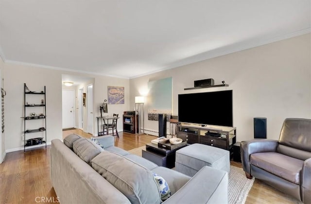 11767 W Sunset Blvd Unit 206, Los Angeles, CA 90049 - living room featuring a baseboard radiator, wood finished floors, ornamental molding, and baseboards