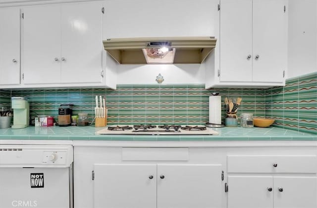 11767 W Sunset Blvd Unit 206, Los Angeles, CA 90049 - kitchen featuring white appliances, white cabinets, decorative backsplash, extractor fan, and tile countertops