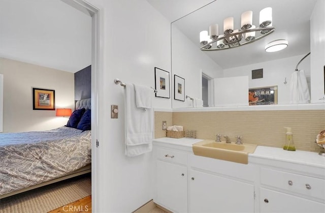 11767 W Sunset Blvd Unit 206, Los Angeles, CA 90049 - ensuite bathroom featuring tasteful backsplash and vanity