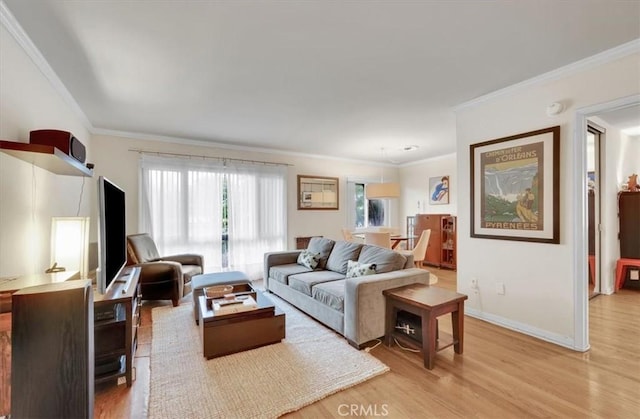 11767 W Sunset Blvd Unit 206, Los Angeles, CA 90049 - living room featuring light wood finished floors, crown molding, and baseboards