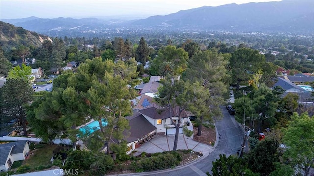 birds eye view of property with a mountain view