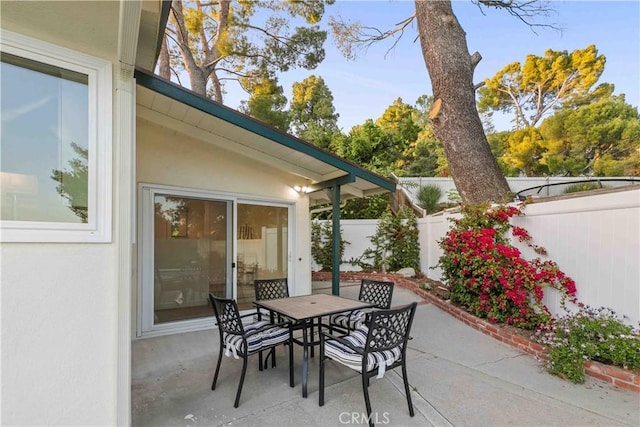 view of patio / terrace featuring outdoor dining area and a fenced backyard