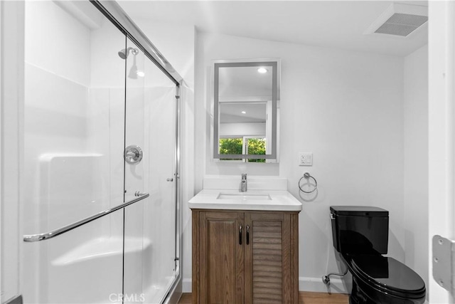 full bathroom with visible vents, a shower stall, vanity, and baseboards