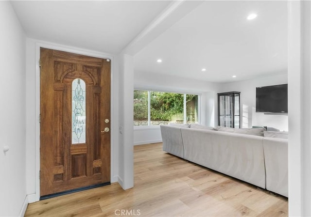 entrance foyer with recessed lighting, baseboards, and light wood-type flooring