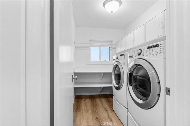 2320 Jayma Ln, La Crescenta, CA 91214 - washroom featuring washing machine and clothes dryer, light wood-style floors, and cabinet space