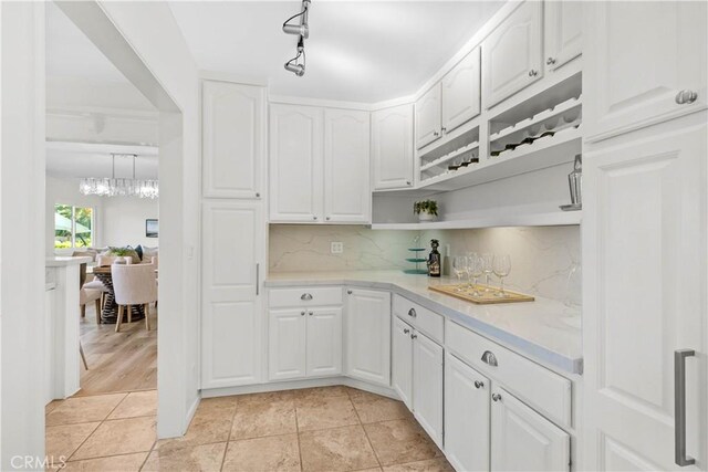 2320 Jayma Ln, La Crescenta, CA 91214 - kitchen featuring light countertops, white cabinetry, open shelves, backsplash, and light tile patterned flooring