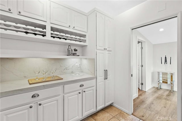 2320 Jayma Ln, La Crescenta, CA 91214 - kitchen featuring open shelves, white cabinetry, and backsplash