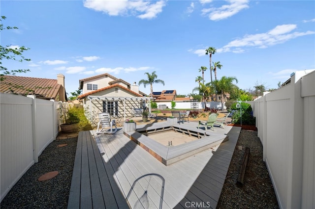 deck featuring a fenced backyard