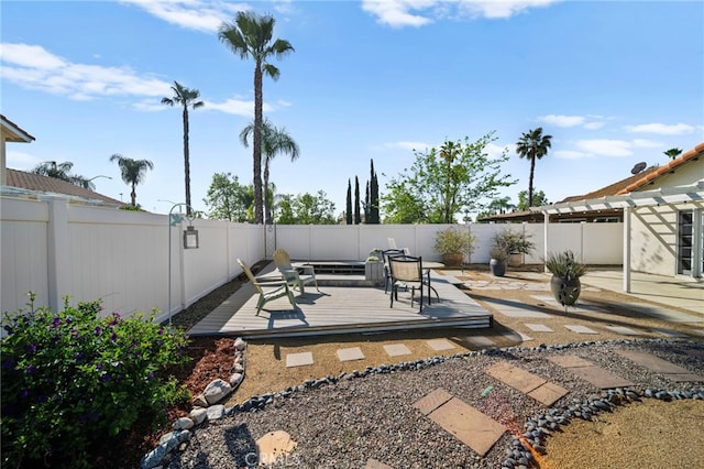 view of patio / terrace featuring a pergola, a deck, and a fenced backyard