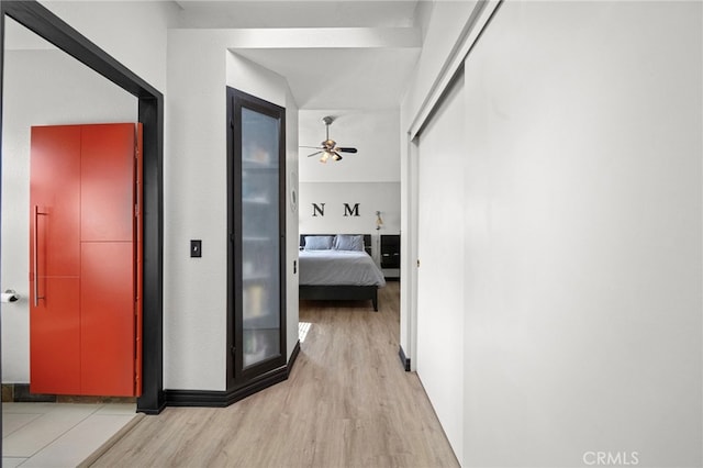 hallway featuring light wood-style flooring